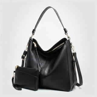 Hobo shoulder bag with matching wallet pouch in black PU leather, featuring gold-tone hardware and a slouchy silhouette.