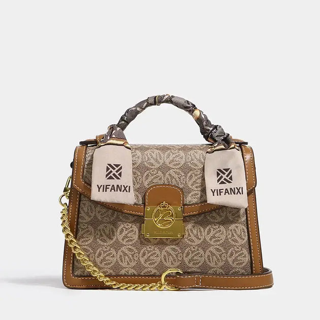 Women's Shoulder Crossbody Bag with floral pattern, ribbon details, and gold chain strap for fashionable styling.