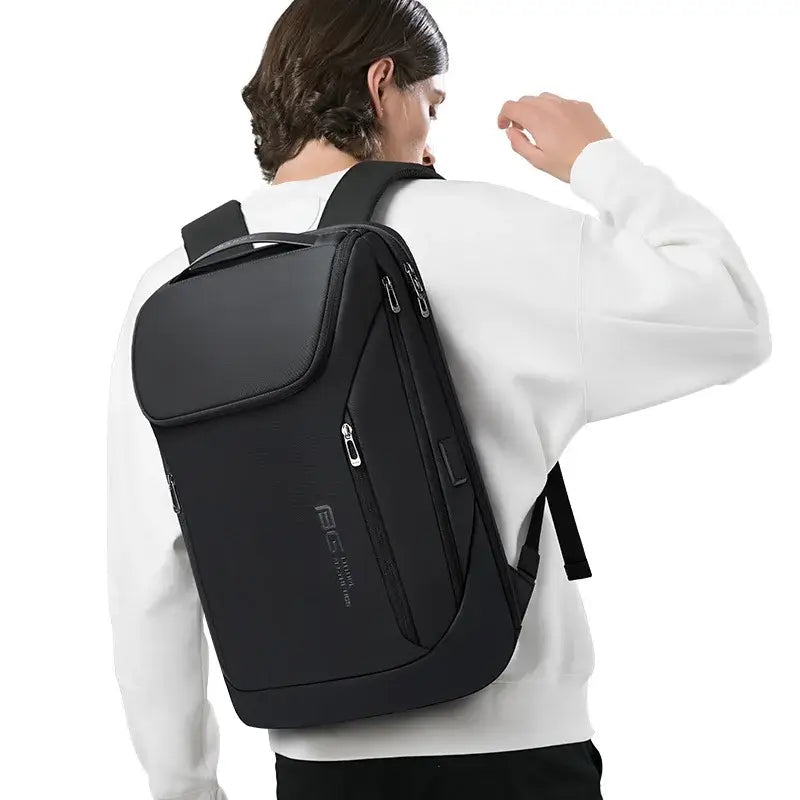 Bange Backpack USB Charging Waterproof shown on a model in a white sweater against a neutral background.