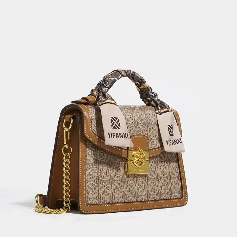 Stylish Women's Shoulder Crossbody Bag featuring gold hardware and floral design.