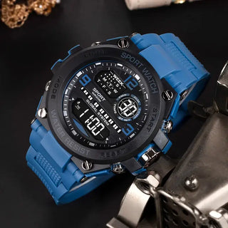Mens Digital Sport Watch in blue with large display and waterproof design, perfect for sports and outdoor activities.
