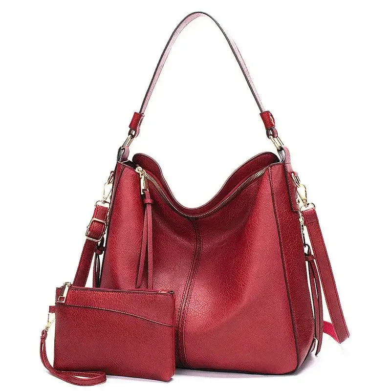 Hobo shoulder bag with matching wallet pouch in stylish red color and slouchy silhouette.