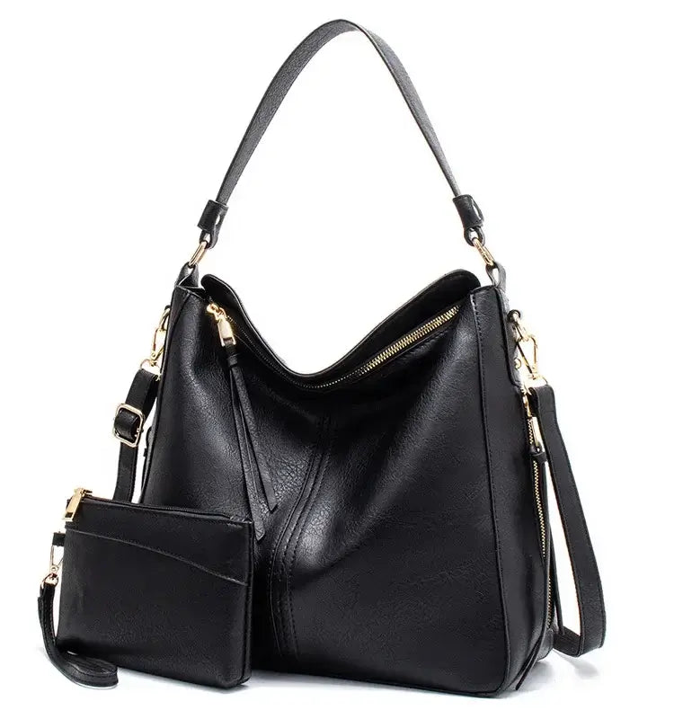 Hobo shoulder bag with wallet pouch in black PU leather, featuring a slouchy silhouette and gold-tone hardware.