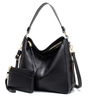 Hobo shoulder bag with wallet pouch in black PU leather, featuring a slouchy silhouette and gold-tone hardware.