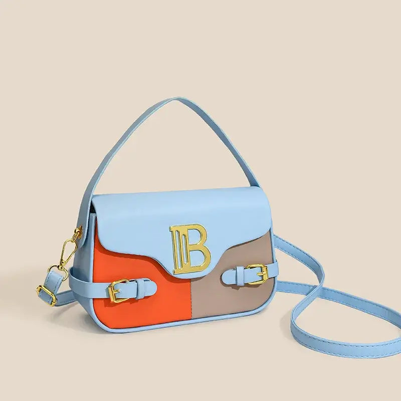 Womens crossbody bag with color-blocking in blue, orange, and brown, featuring gold hardware and a stylish design.
