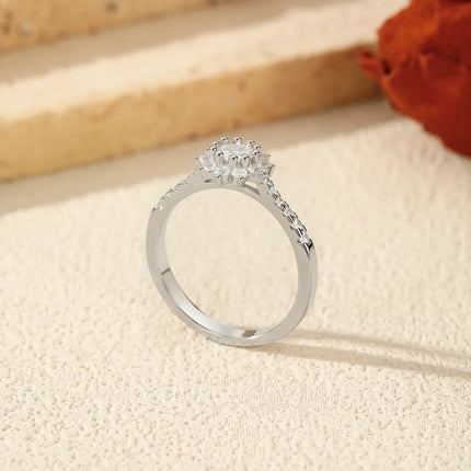 Moissanite Halo Ring in 925 Sterling Silver with a round-cut D-color VVS1 moissanite in a refined prong setting.