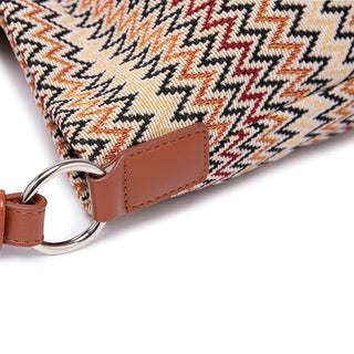 Women's shoulder bag featuring multicolor zigzag pattern, durable polyester, and stylish leather accents.