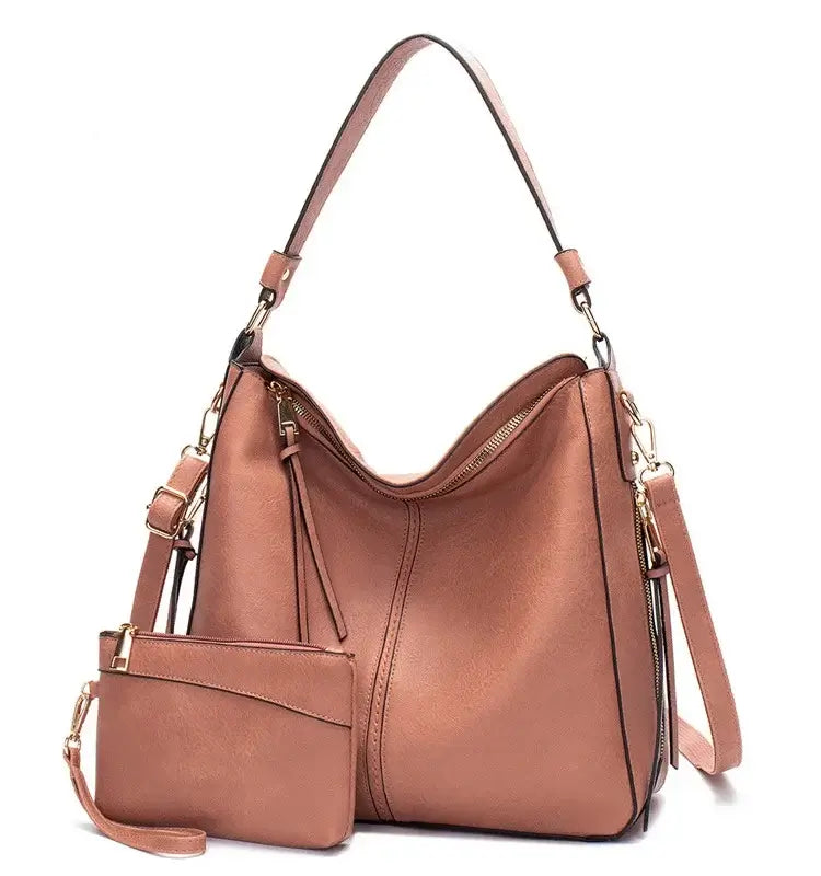 Hobo shoulder bag with matching wallet pouch in soft brown PU leather, featuring gold-tone hardware and secure zip closure.