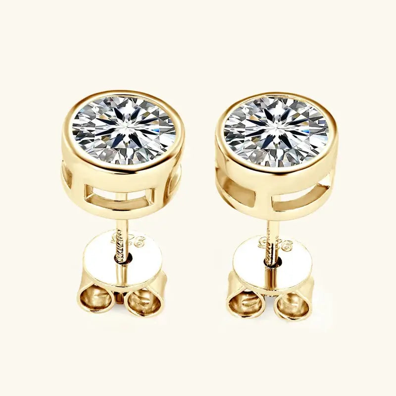 Round Moissanite Stud Earrings displayed in gold setting featuring push-back fastenings.