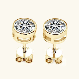 Round Moissanite Stud Earrings displayed in gold setting featuring push-back fastenings.