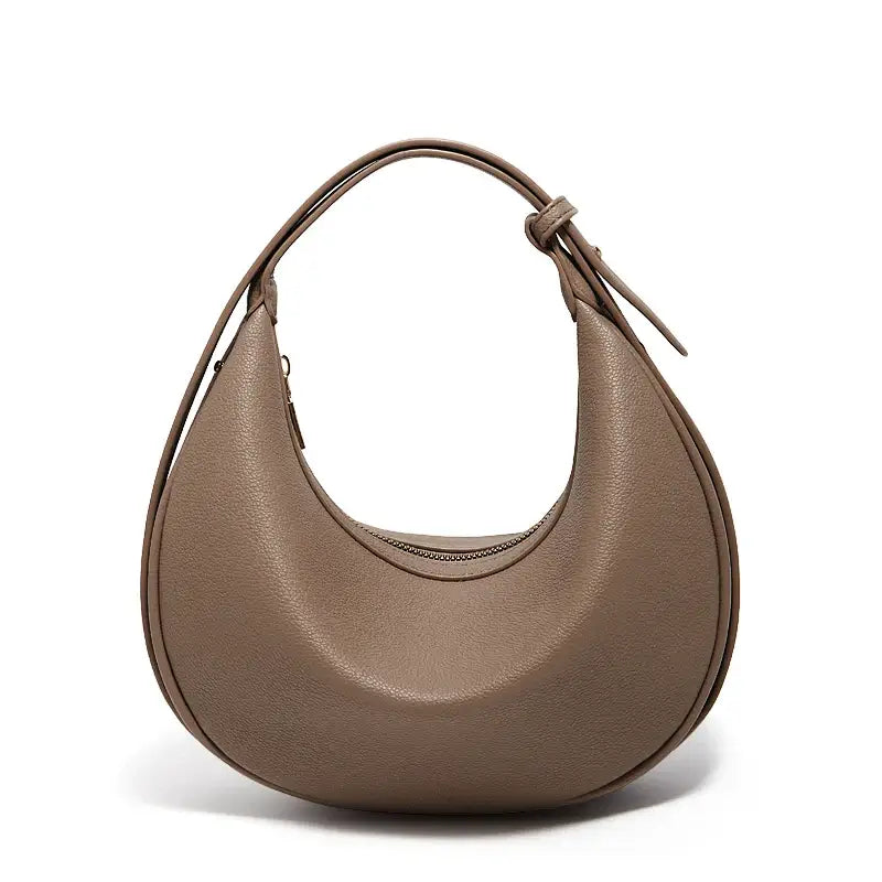 Half Moon Bag with Minimalist Design in brown faux leather, casual shoulder bag with soft structure.