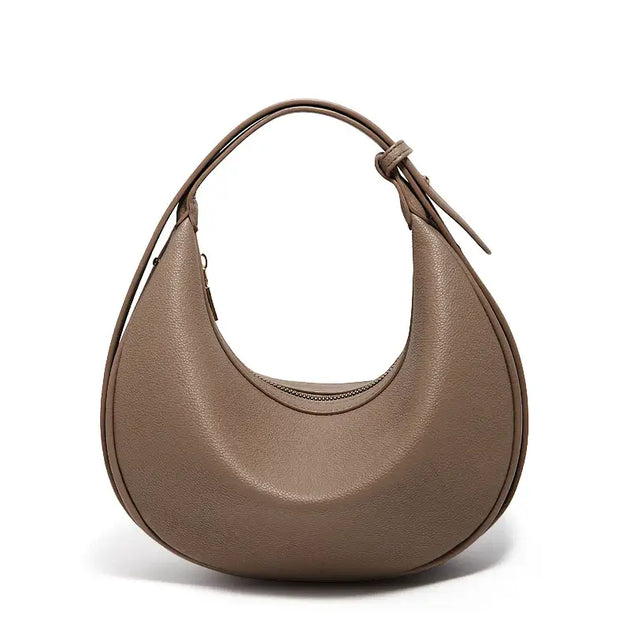 Half Moon Bag with Minimalist Design in brown faux leather, casual shoulder bag with soft structure.