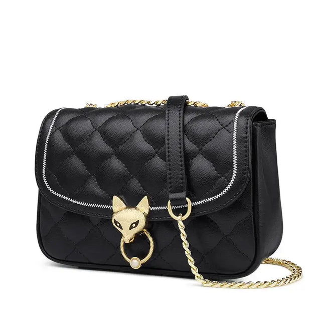 Stylish Leather Crossbody Bag with quilted pattern, gold chain strap, and unique fox decoration.