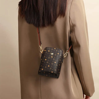 Women's Cellphone Bag displayed on a model wearing a beige coat, showcasing an elegant messenger style.