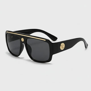 Sunglasses with gold detailing, stylish black frame, ideal for casual adult wear.