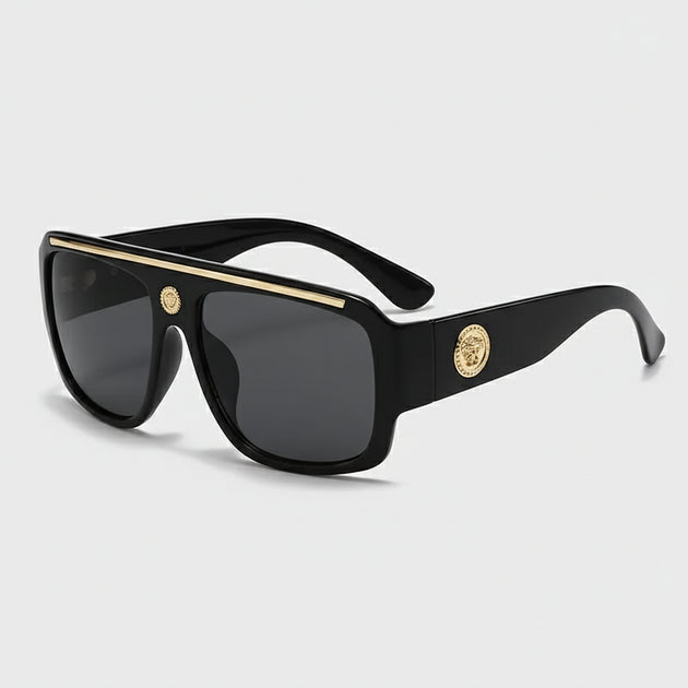 Sunglasses with gold detailing, stylish black frame, ideal for casual adult wear.