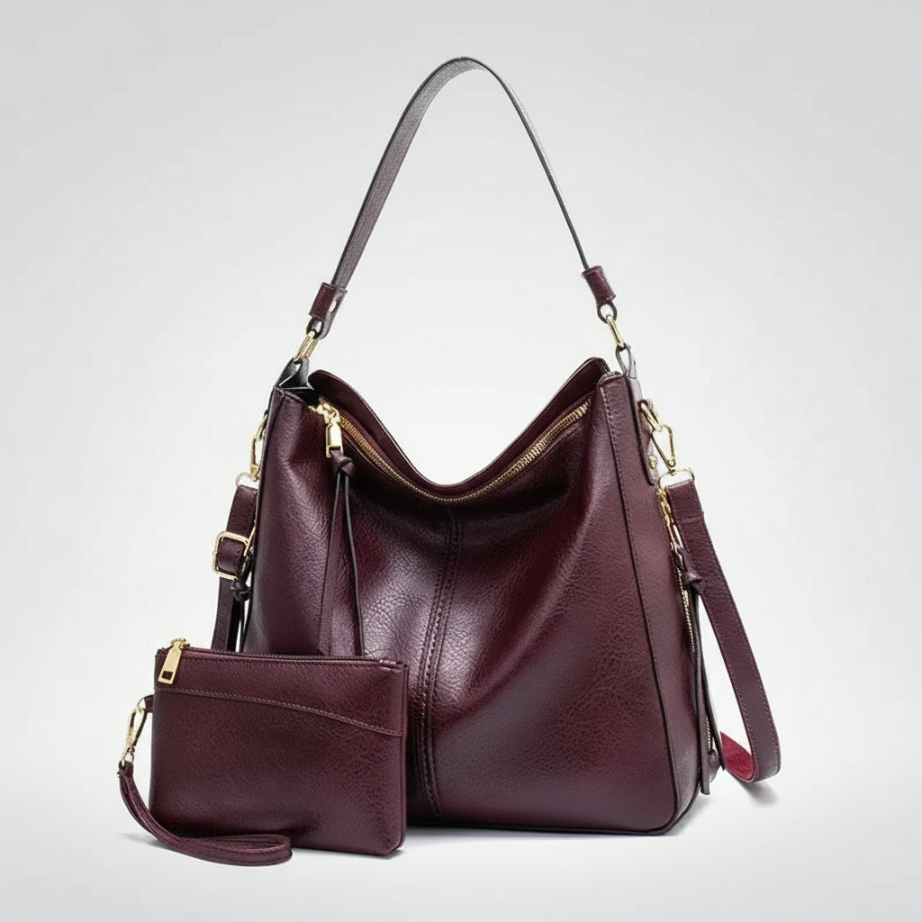 Hobo shoulder bag with matching wallet pouch in burgundy PU leather, featuring a slouchy silhouette and gold-tone hardware.