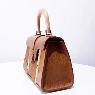 Handbag with wooden handle and rivet decoration, stylish and durable for women, perfect addition to any outfit.