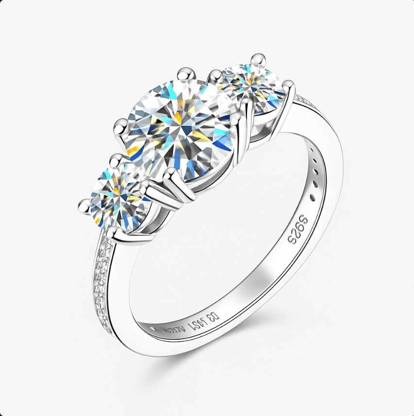 Moissanite Ring – 925 Sterling Silver Three-Stone Design featuring sparkling round-cut moissanite stones.