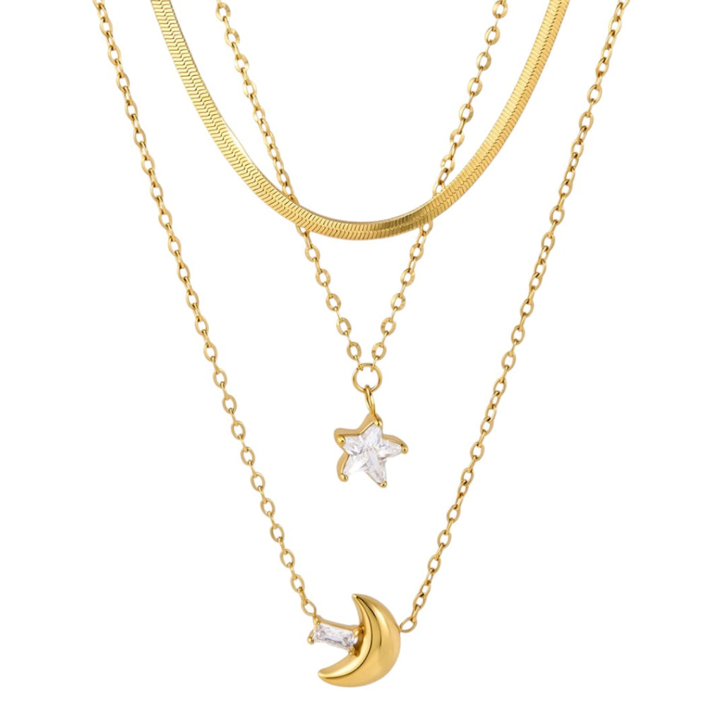 Two gold necklaces with star and moon pendants on a white background
