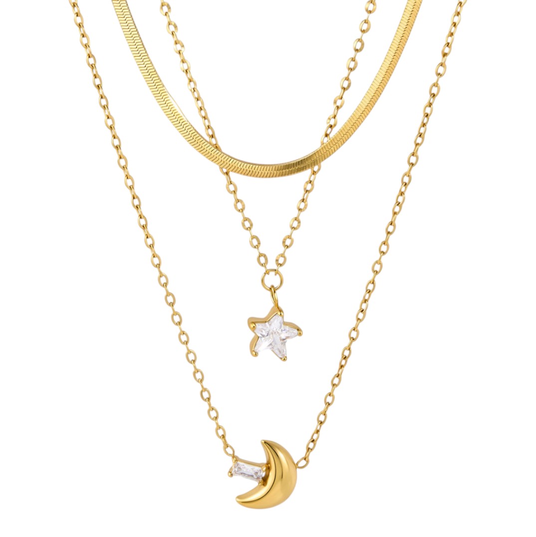Two gold necklaces with star and moon pendants on a white background
