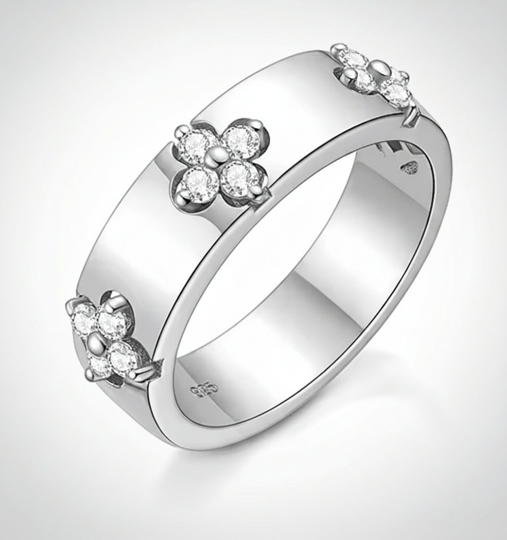 Moissanite Ring – 925 Sterling Silver featuring floral design with sparkling stones on a smooth band.