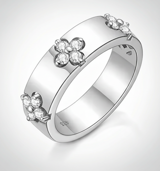Moissanite Ring – 925 Sterling Silver featuring floral design with sparkling stones on a smooth band.