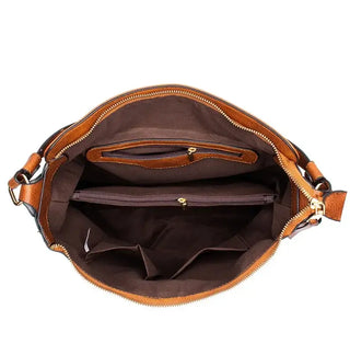 Inside view of hobo shoulder bag showing spacious compartments and pockets for organization.