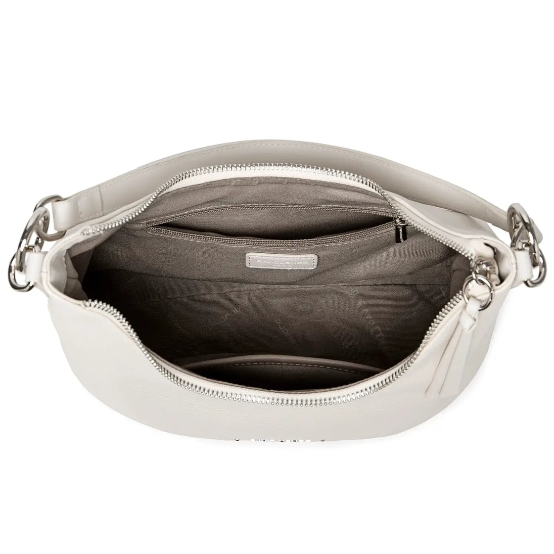 Luxury white crossbody bag interior with zipper and slot pockets, ideal for casual outings.