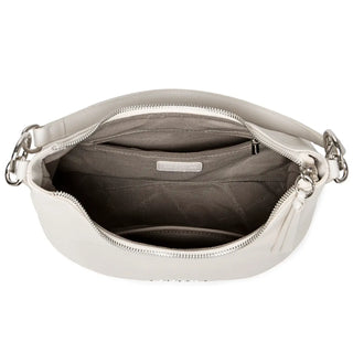 Luxury white crossbody bag interior with zipper and slot pockets, ideal for casual outings.