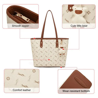 Shopper Bag with cute bear keychain charm features smooth zipper, comfort leather, and wear-resistant bottom.