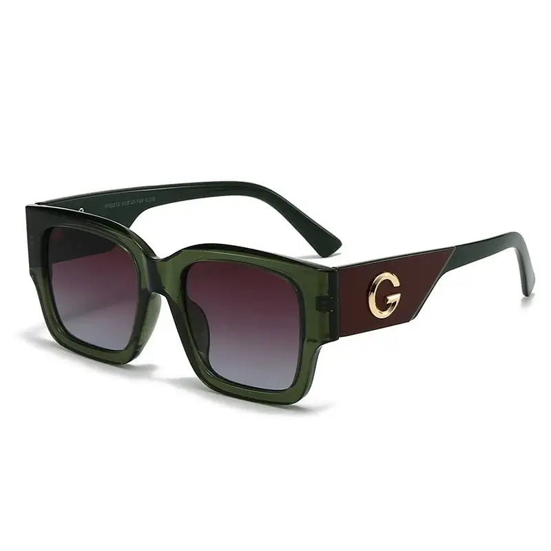 Sunglasses with gold G emblem featuring green frame and gradient lenses, perfect for casual wear.