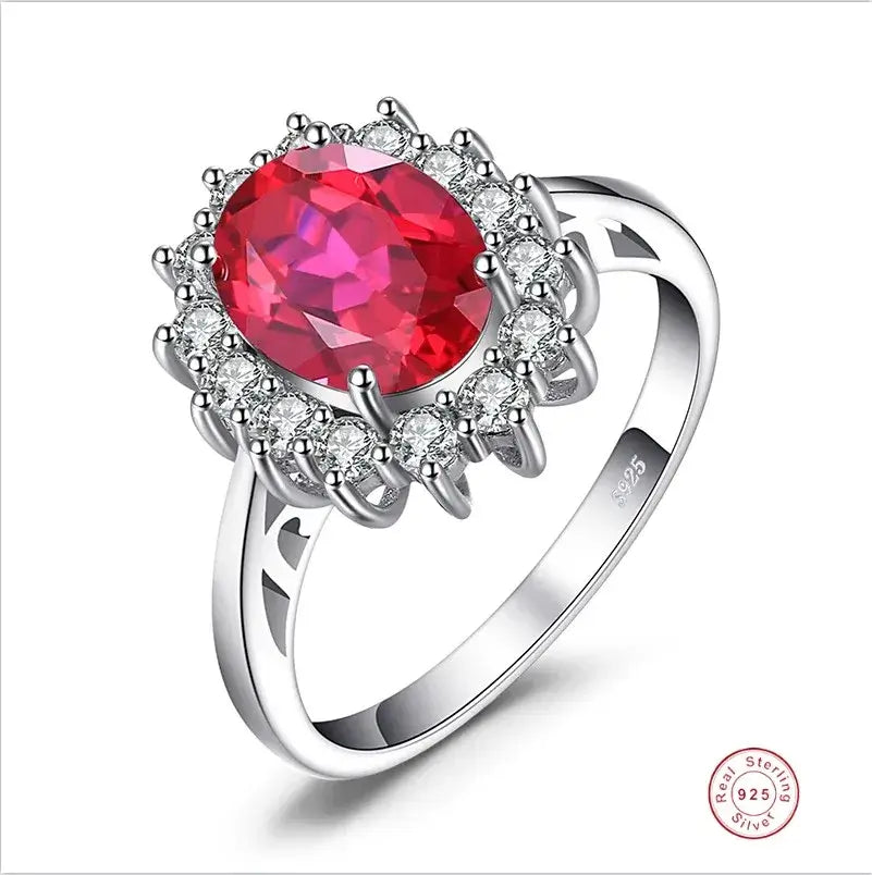 Rings Sterling Silver with Oval Blue Sapphire Crystal displayed in a stylish design, featuring a shiny oval gemstone and accent stones.