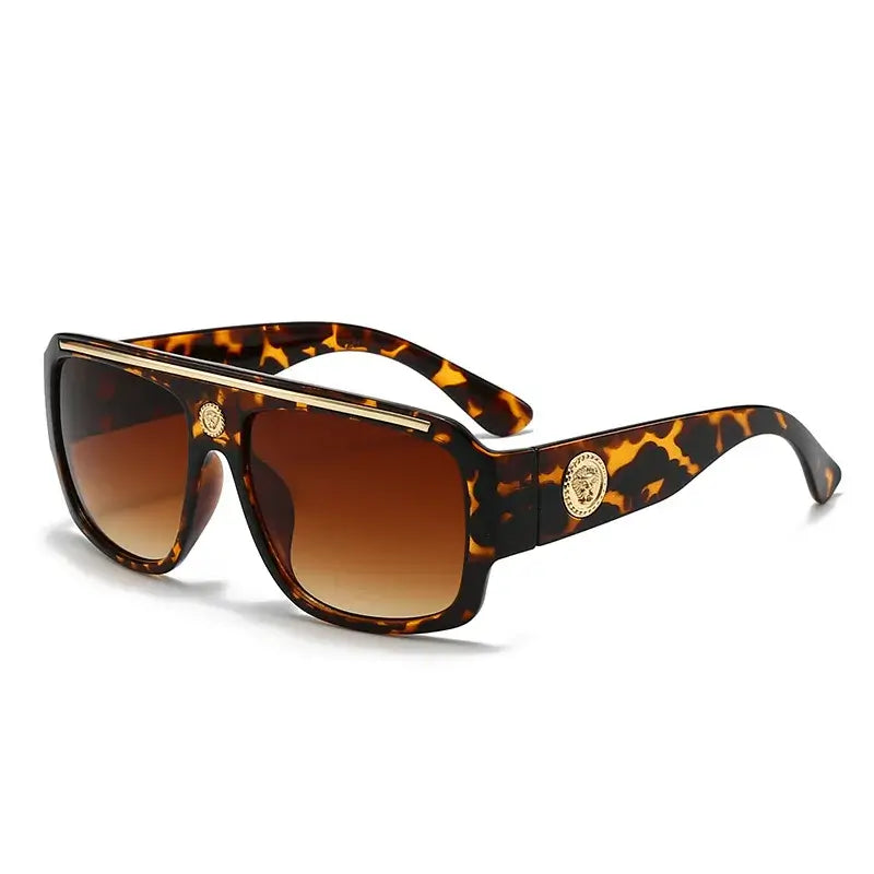 Sunglasses with gold detailing in a stylish tortoiseshell design, perfect for casual adult wear.