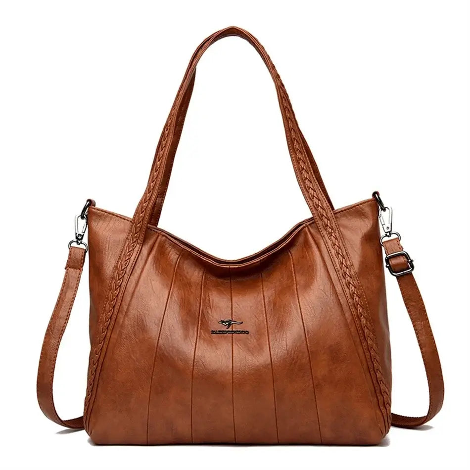 Soft Leather Handbag featuring a zipper closure, kangaroo logo, and stylish braided straps.