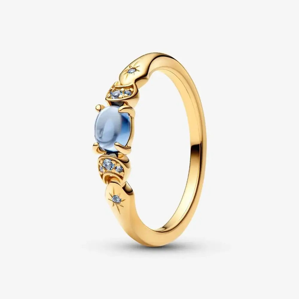 New Princess Ring Series Sterling Silver featuring a gold band with blue stone and sparkling accents.