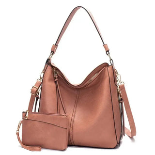 Hobo shoulder bag with matching wallet pouch in soft brown PU leather, featuring a slouchy design and gold-tone hardware.