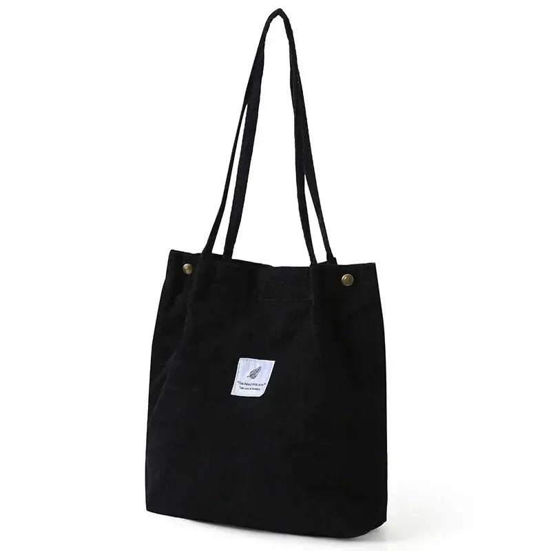 Shopping Tote Bags with Long Handles in black corduroy and canvas, featuring a modern design and durable construction.