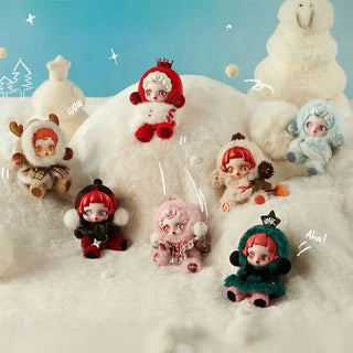 Colorful designer collectible dolls in winter outfits, perfect for fans and collectors, surrounded by snow-themed decor.