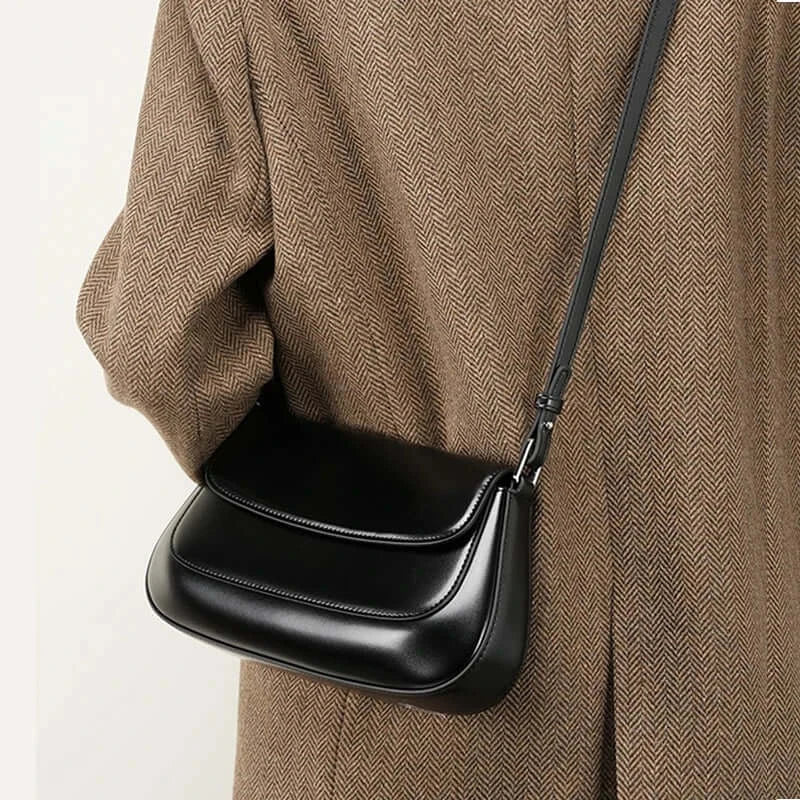 Shoulder bag leather solid black, crafted from premium cowhide, adds a touch of elegance to any outfit.