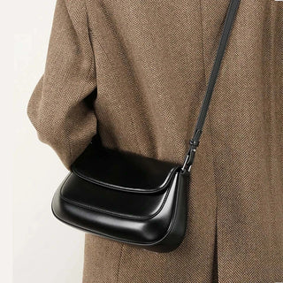 Shoulder bag leather solid black, crafted from premium cowhide, adds a touch of elegance to any outfit.