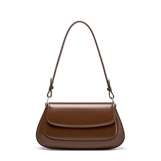 Shoulder bag leather solid brown. Premium cowhide saddle bag with minimalist design and spacious interior.