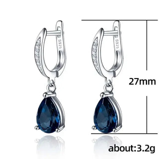 Sterling silver drop earrings with blue crystal, suitable for anniversary, engagement, or party occasions.