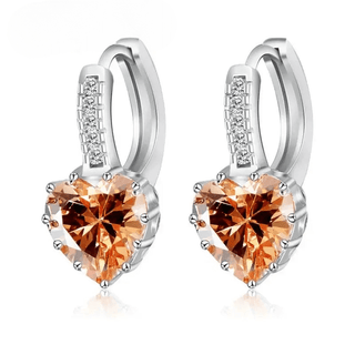 Sterling silver hoop earrings with heart-shaped orange crystal, elegant and trendy design for women.