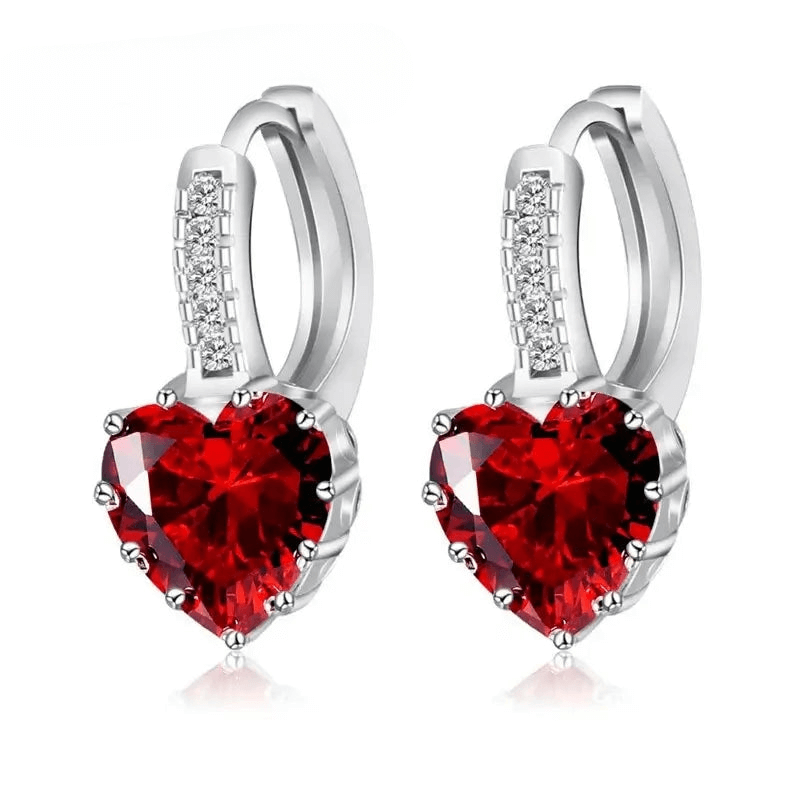 Red heart-shaped earrings in sterling silver, featuring cubic zirconia detail, perfect for special occasions.