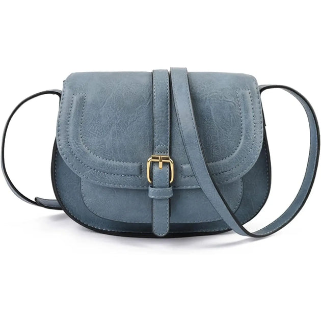 Leather crossbody bag in blue, featuring a stylish shell shape, zipper closure, and glamorous gold buckle.