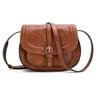 Brown leather crossbody bag with buckle closure, offering stylish practicality for everyday use.