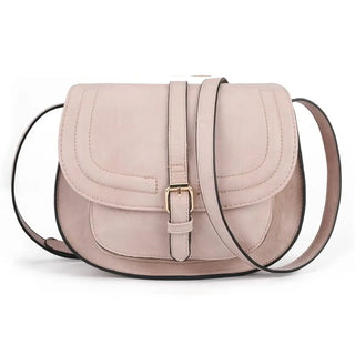 Leather crossbody bag in soft pink with a sleek silhouette and buckle closure for modern style.