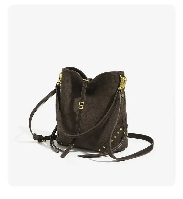 Brown soft polyester shoulder tote bag with rivet details, perfect for hip-hop style, ideal for daily use by women.