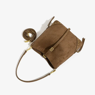 Brown large capacity rivet vintage shoulder tote bag for women, hip-hop style, soft polyester lining.